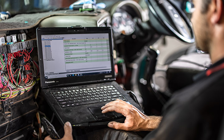 Mechanic using laptop