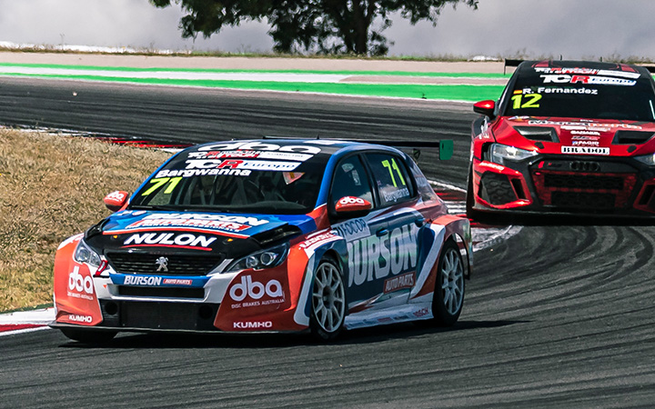 Ben Bargwanna smiling to the camera holding his winning trophy