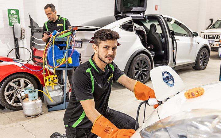 Man working on electric vehicle