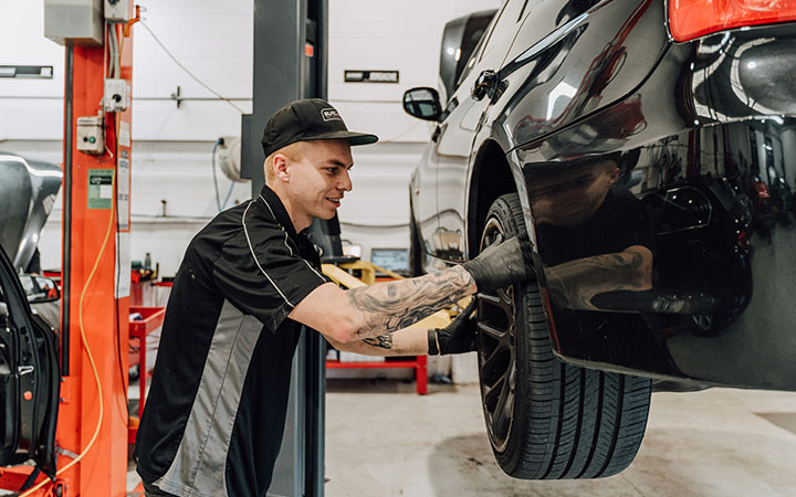 Person working on car