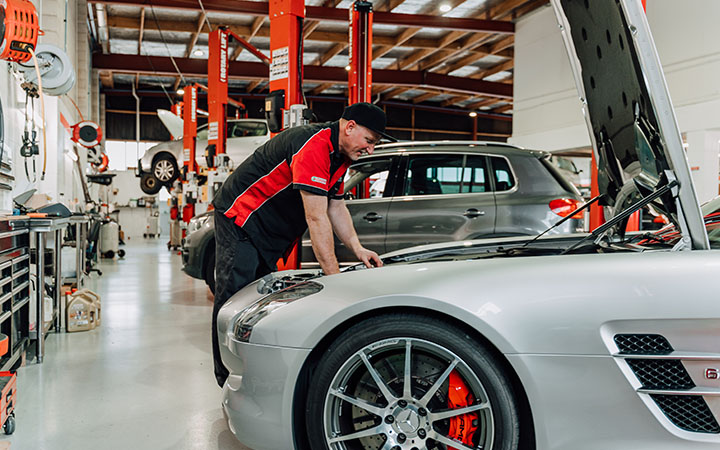 Person working on car