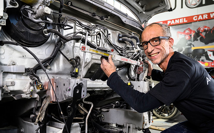 Man in front of engine