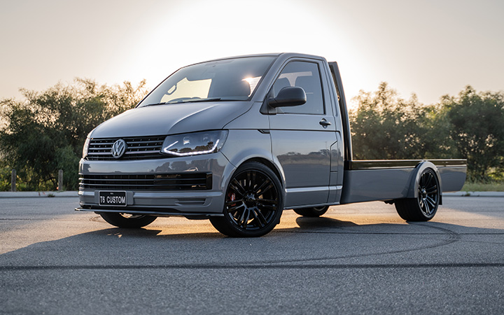 A Volkswagen Transporter parked under the sunset
