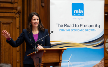 Erica Stanford giving a speech at an MTA event
