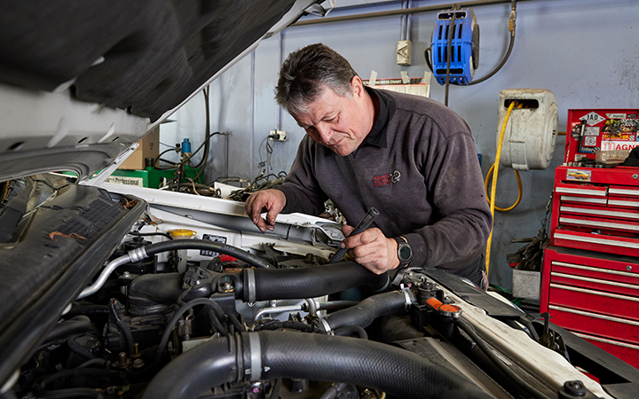 Mechanic checking a car engineer