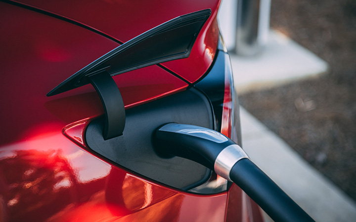 Electric vehicle being charged