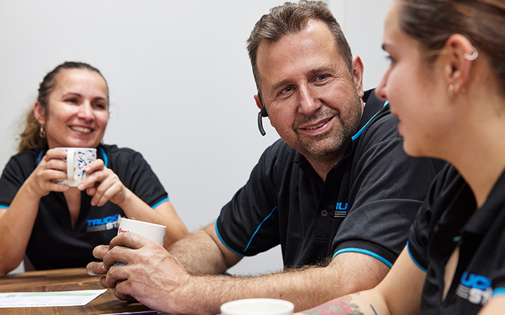 Staff having a warm drink and talking