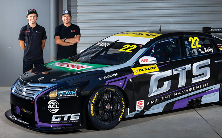 Mason and Todd Kelly standing behind this years Supercar's car
