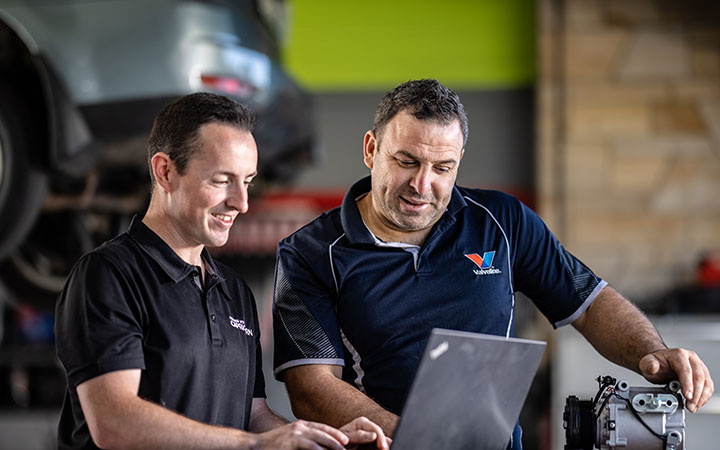 Two men looking at the myCAP portal 