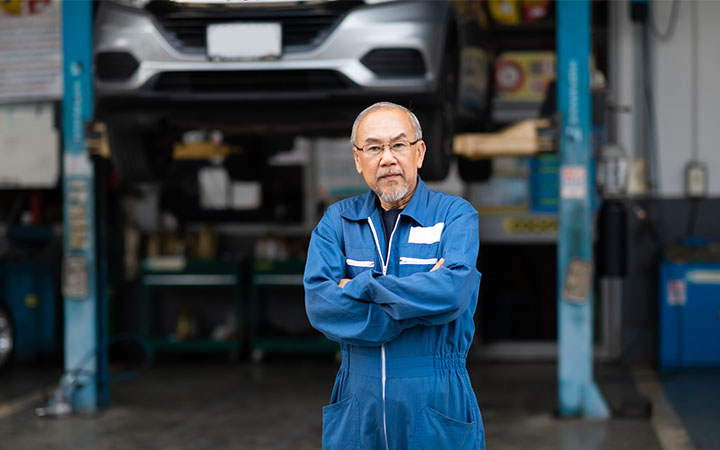 Man in front of workshop