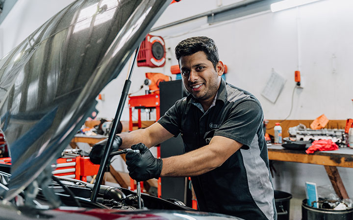 Person working on car
