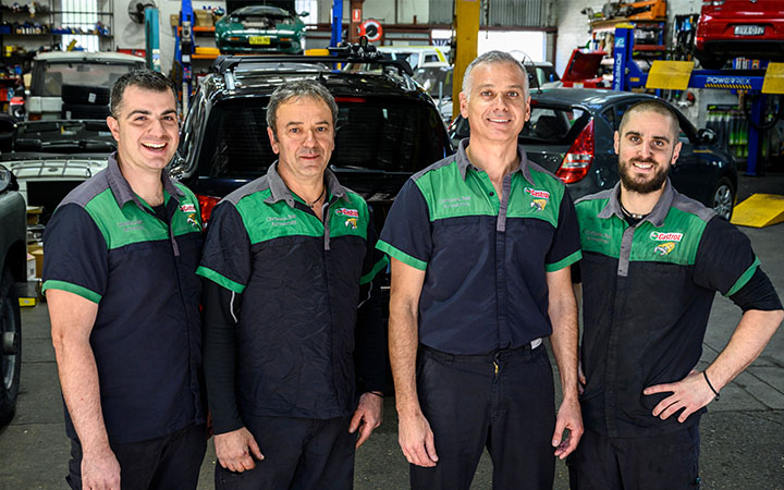 Four men in workshop