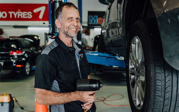 Man using tyre equipment