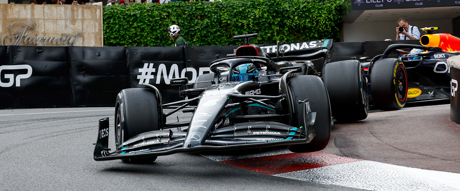 Mercedes followed by the Red Bull F1 cars racing in Monaco