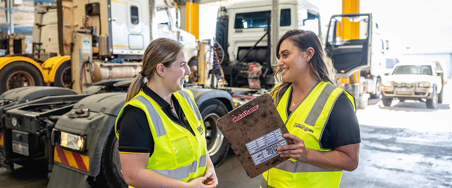 Capricorn Area Manager discussing Member Returns with a Member in their workshop.