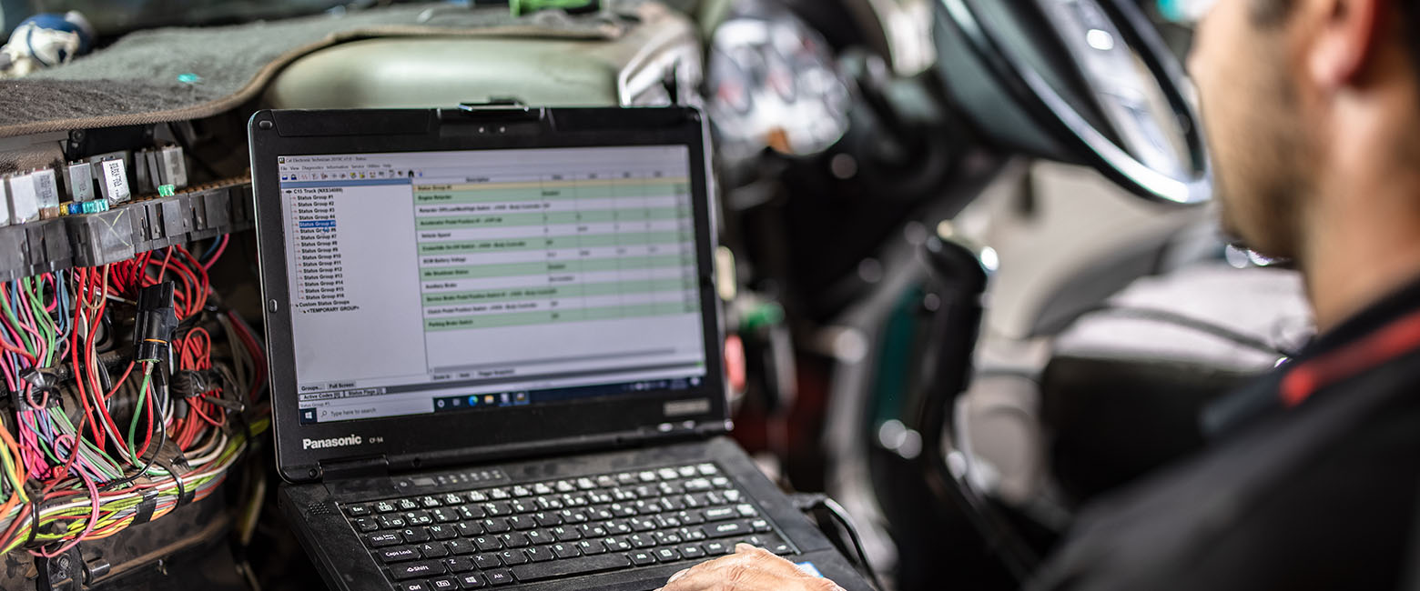 Mechanic using laptop