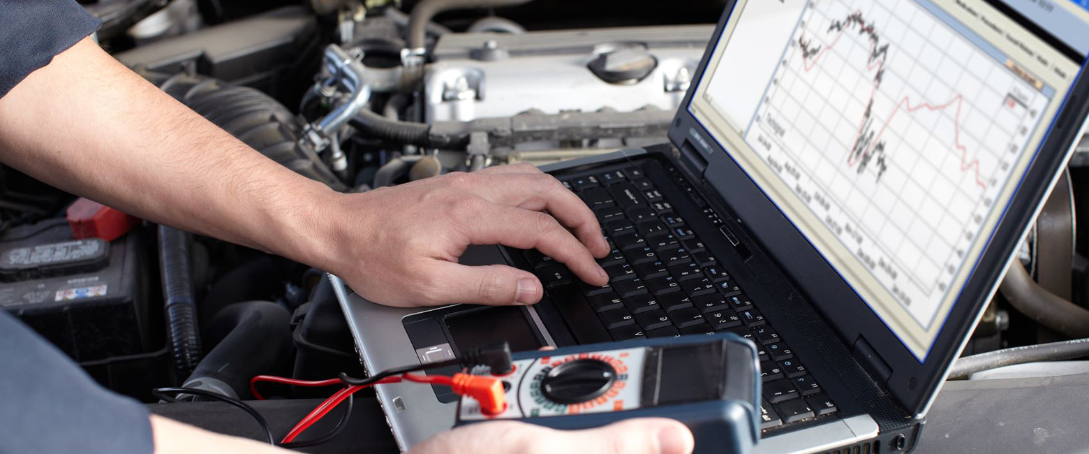 Technician scanning a car engineer
