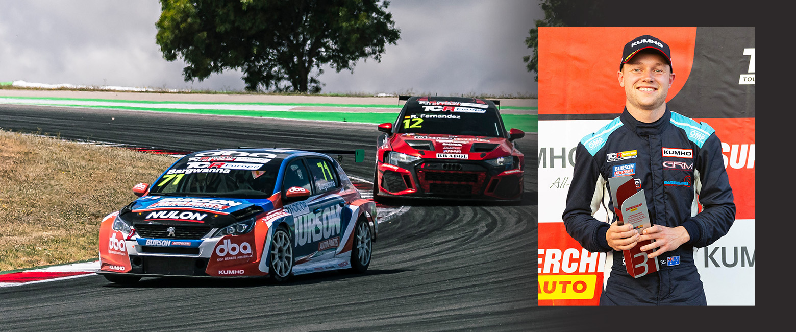 Ben Bargwanna smiling to the camera holding his winning trophy