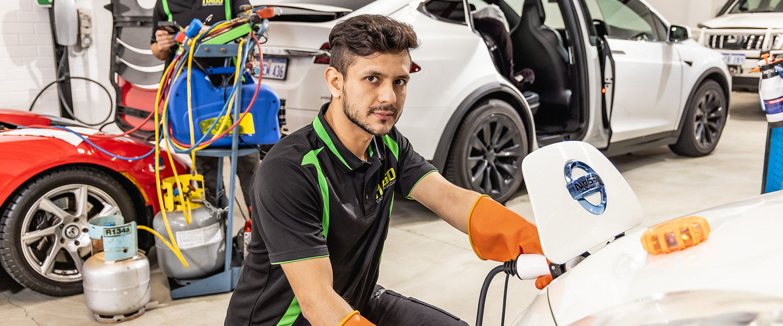 Man working on electric vehicle
