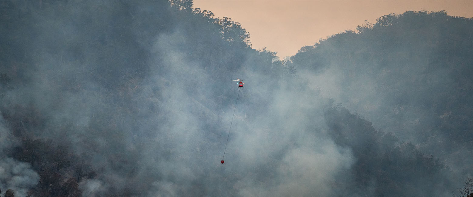 Helicopter over bushfire