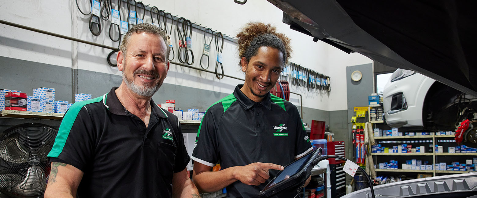 People working on car