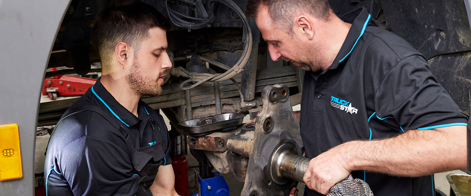 People working on vehicle