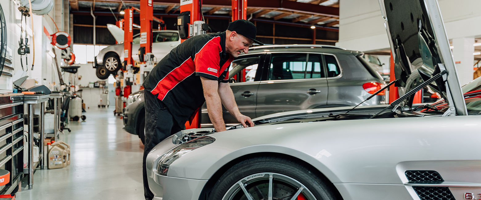 Person working on car