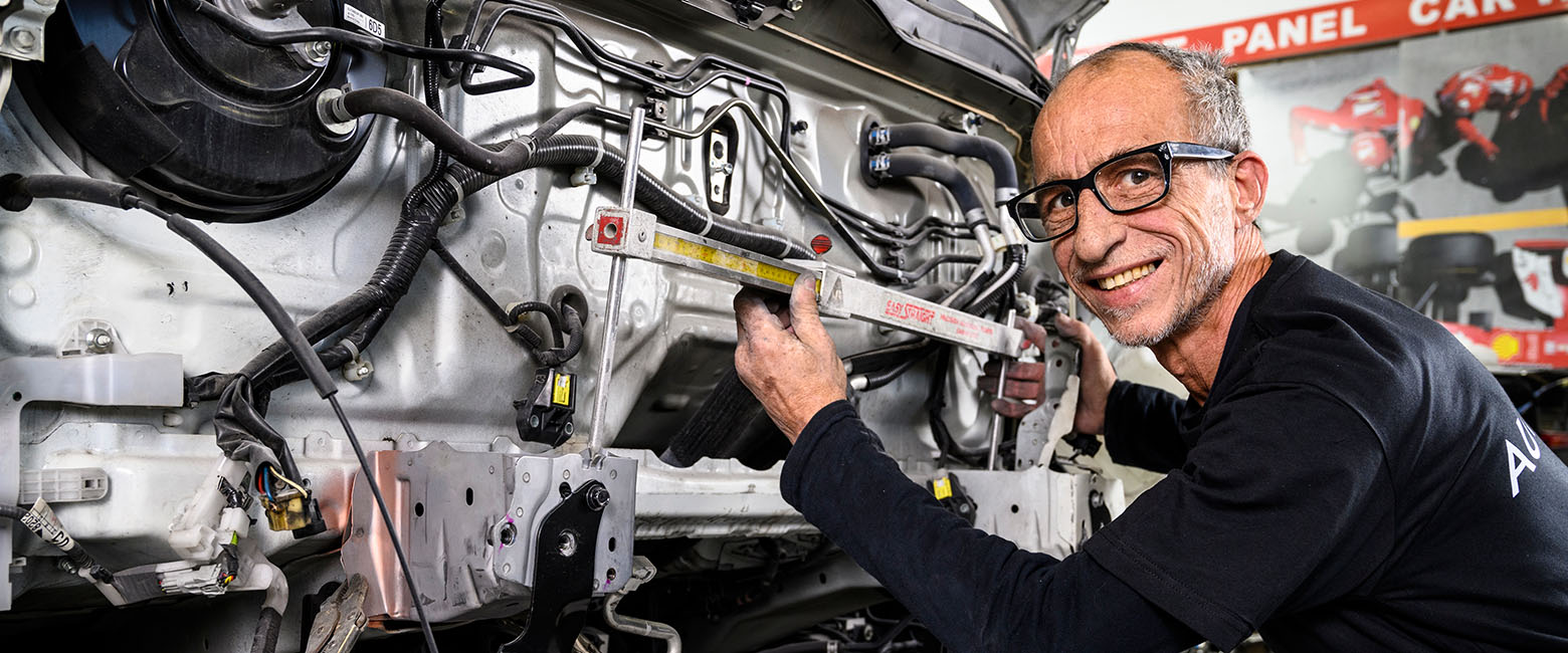Man in front of engine