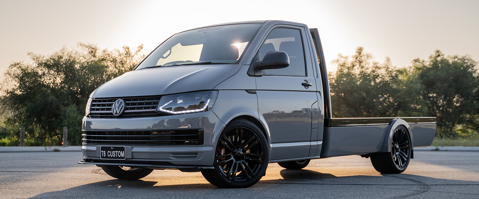 A Volkswagen Transporter parked under the sunset