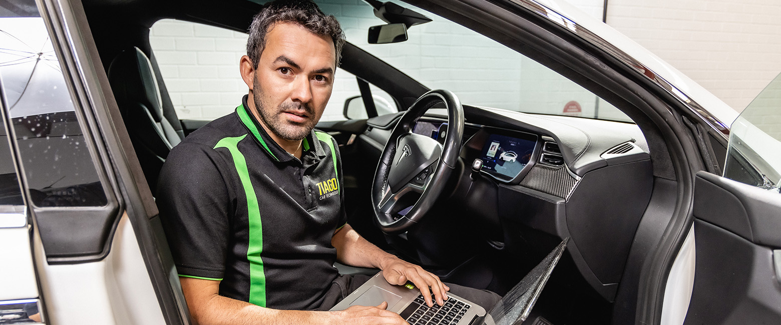 Technician scanning a car engineer