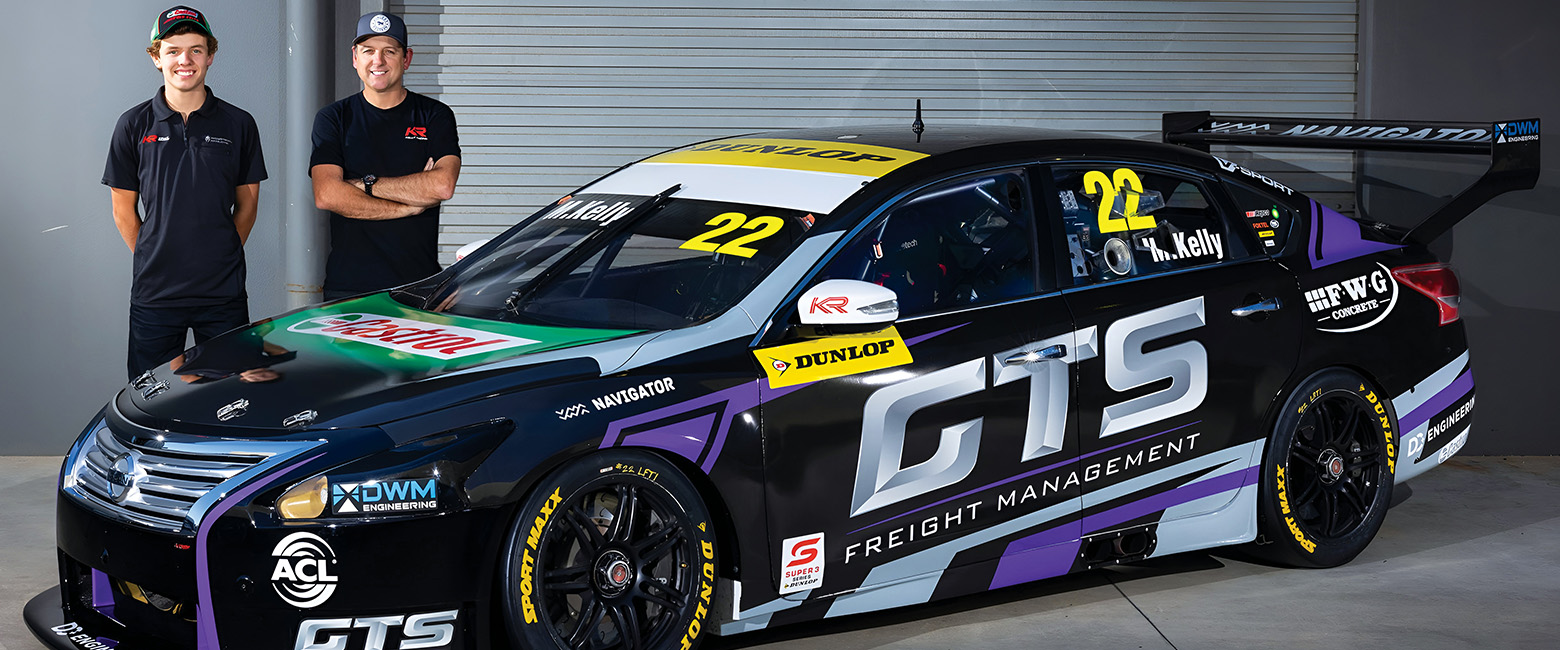 Mason and Todd Kelly standing behind this years Supercar's car