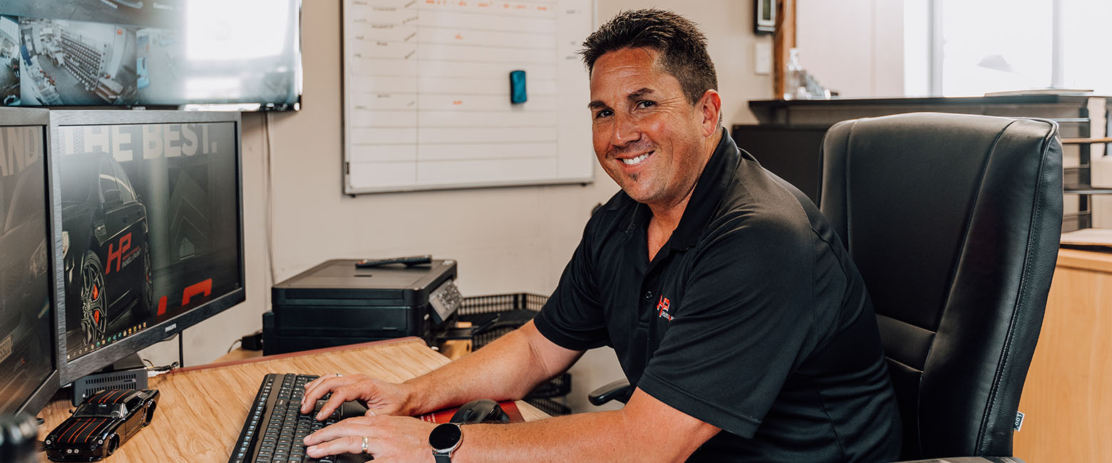 Happy Capricorn Member On Computer