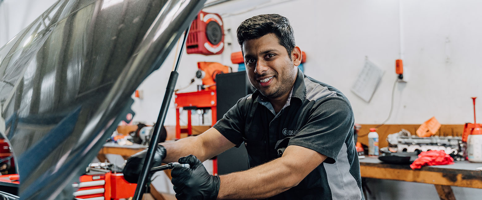 Person working on car