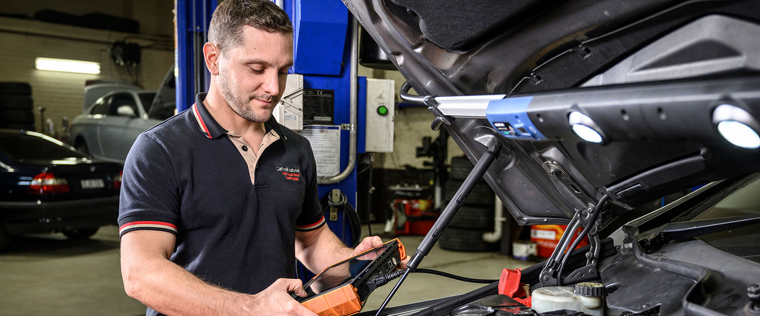 Man using diagnostic tool