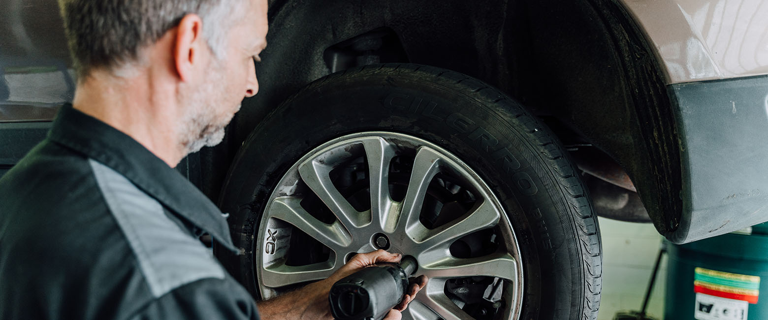 Man using tyre equipment