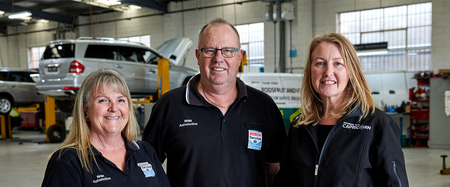 Three people in workshop