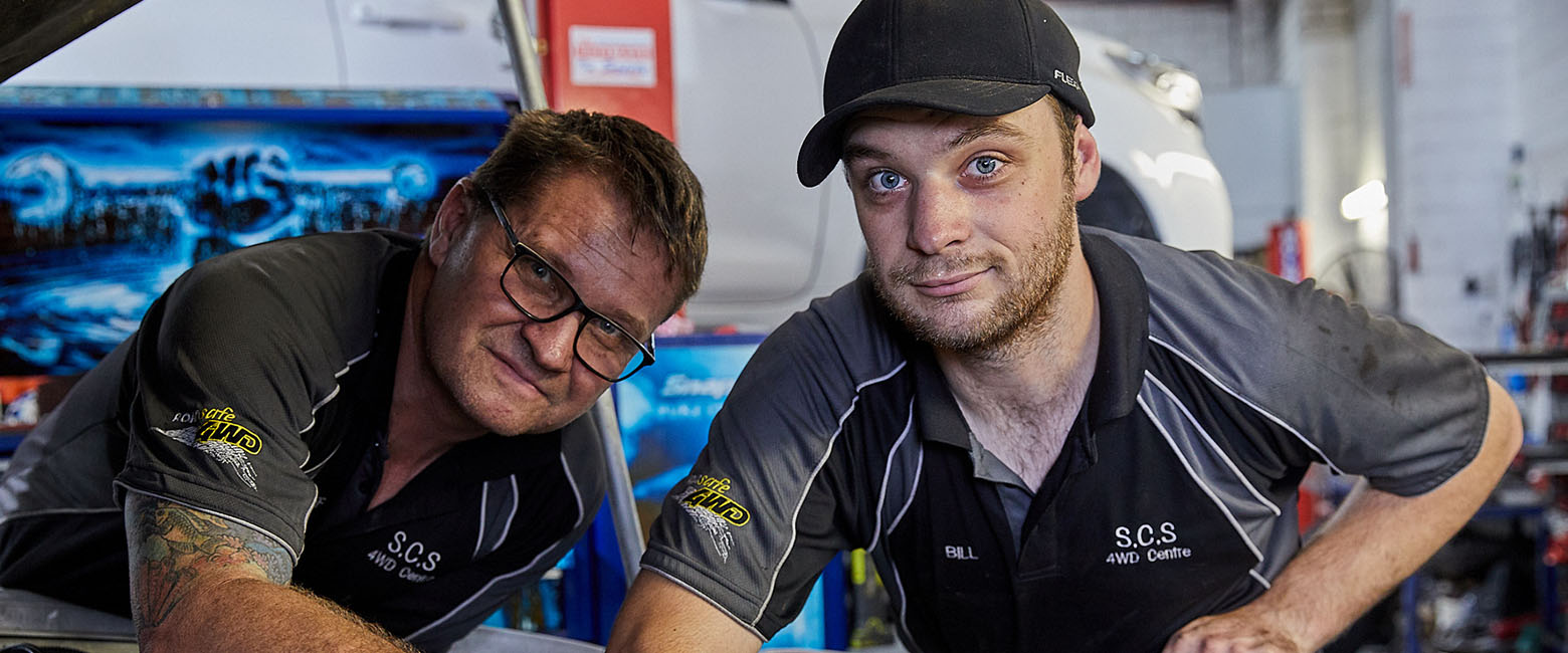 People working on car