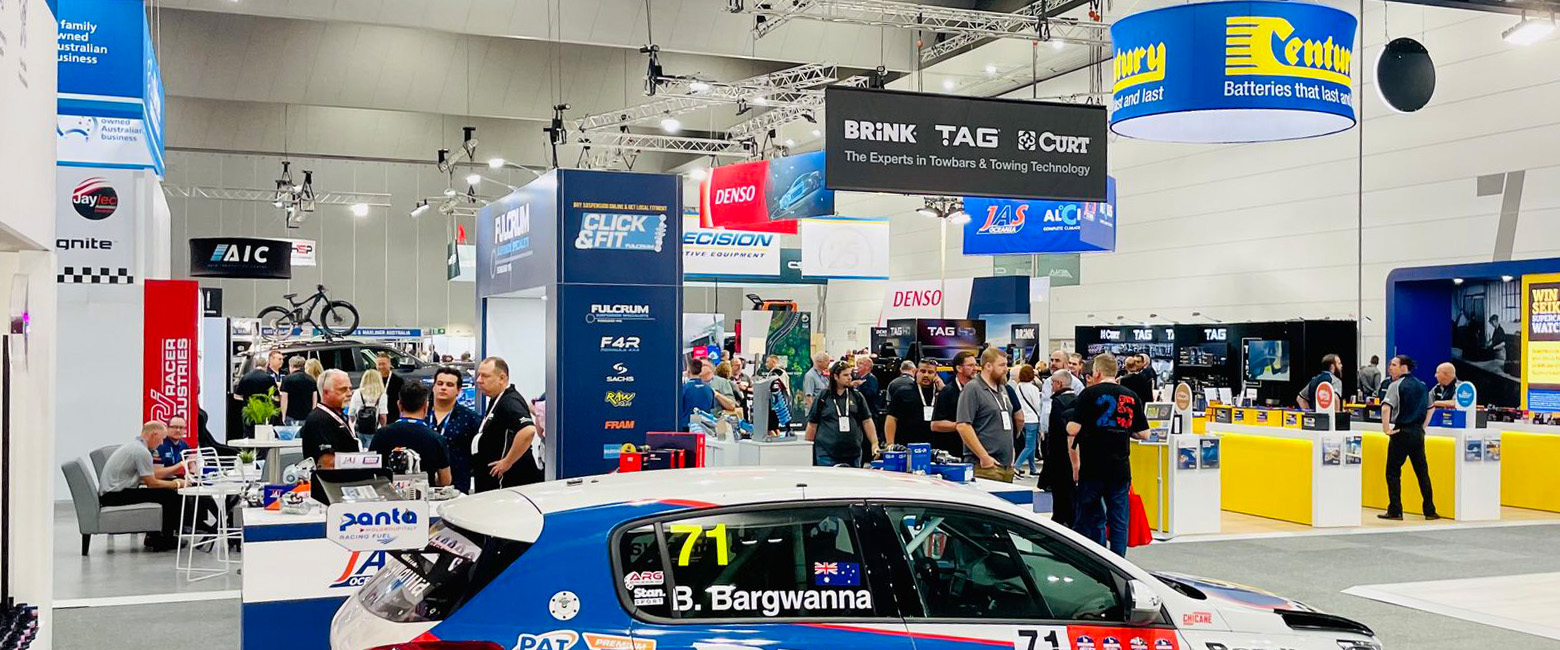  Visitors at the 2022 AAAExpo car showroom, looking at the latest vehicle offerings with interest