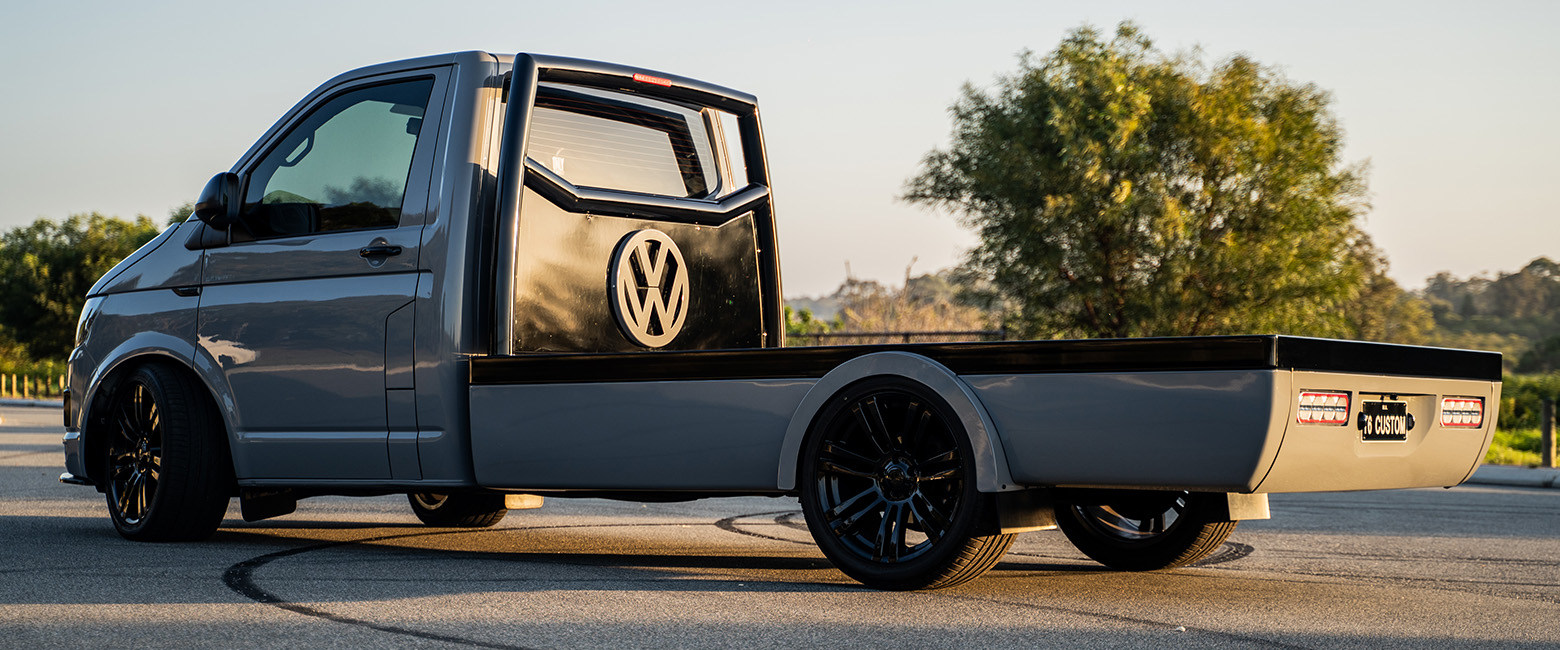 A Volkswagen Transporter parked under the sunset