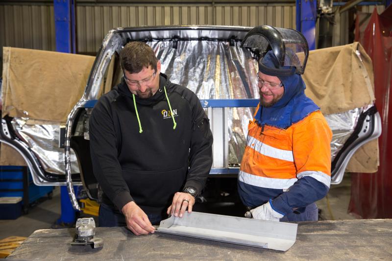 Two men fabricating