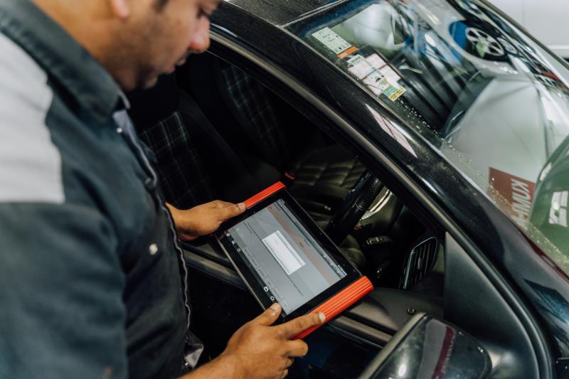 Man using diagnostic tool