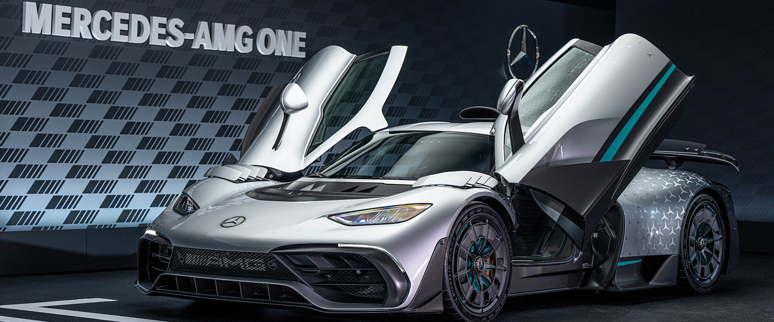 Mercedes-AMG ONE concept car with butterfly doors open, showcasing its sleek design and advanced engineering.