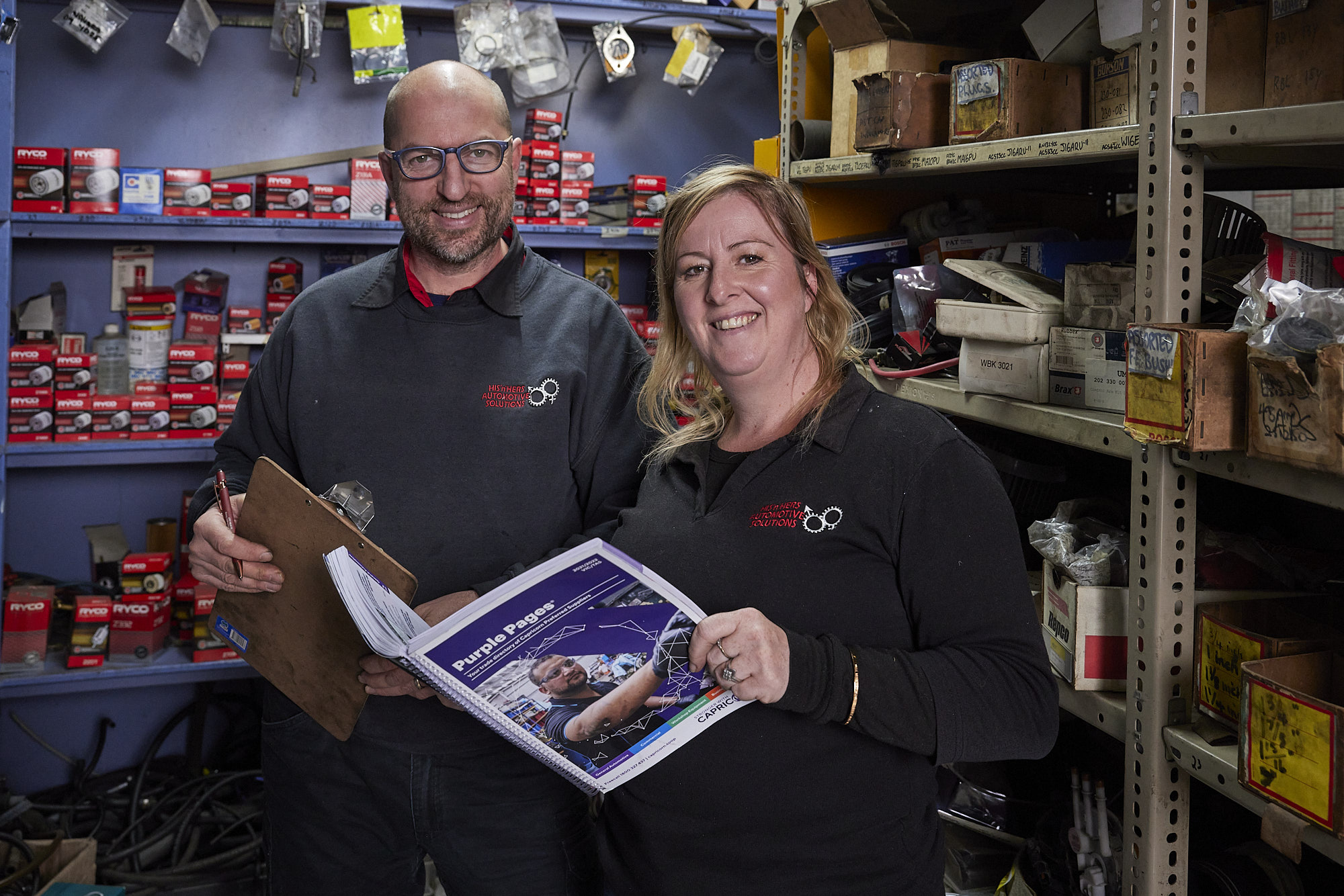 Carolina and Craig working in the workshop's storage