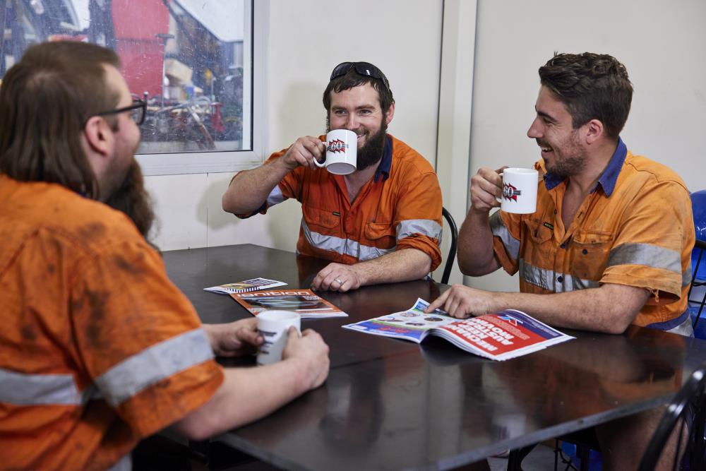 Men sitting around table
