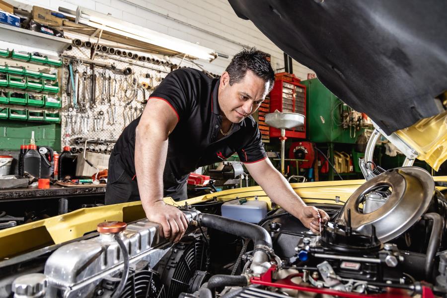 Technician working on engine