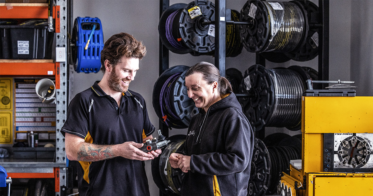 Tina talking with one of the mechanics