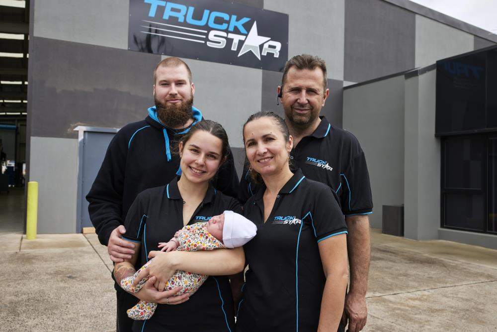 Family in front of workshop