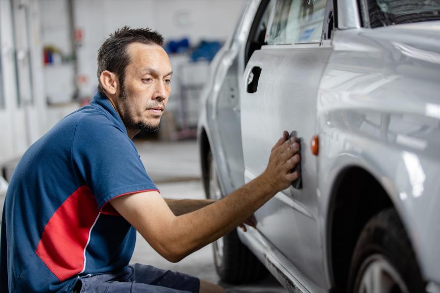 Person working on car