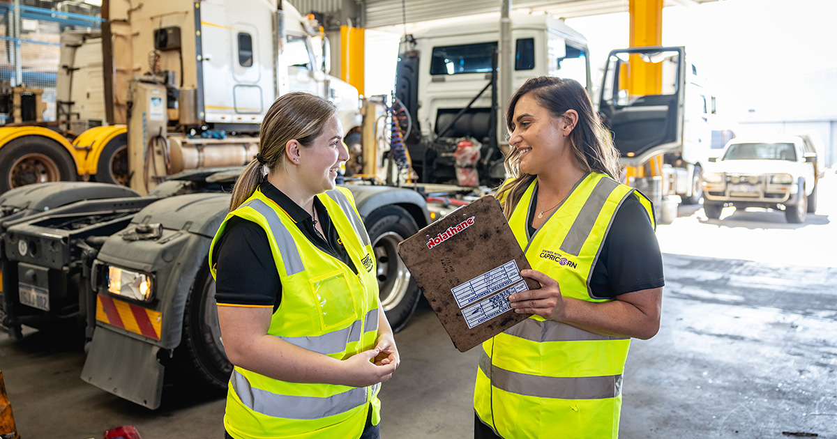 Capricorn Area Manager discussing Member Returns with a Member in their workshop.