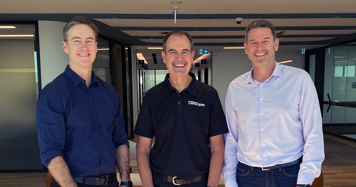 Brad, David and Mark standing and smiling to the camera